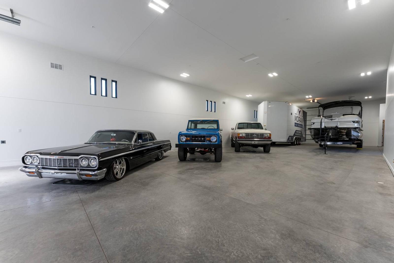 A 1964 Impala, a 1971 Bronco and a 1988 Ford pickup in the garage at 6287 Avienda De Las Colinas