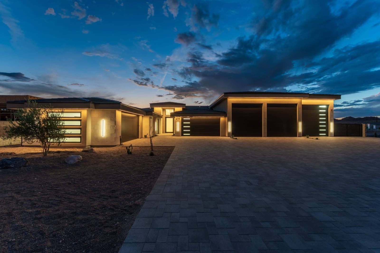 Twilight exterior and RV garages at 6719 Corte De Los Bueyes