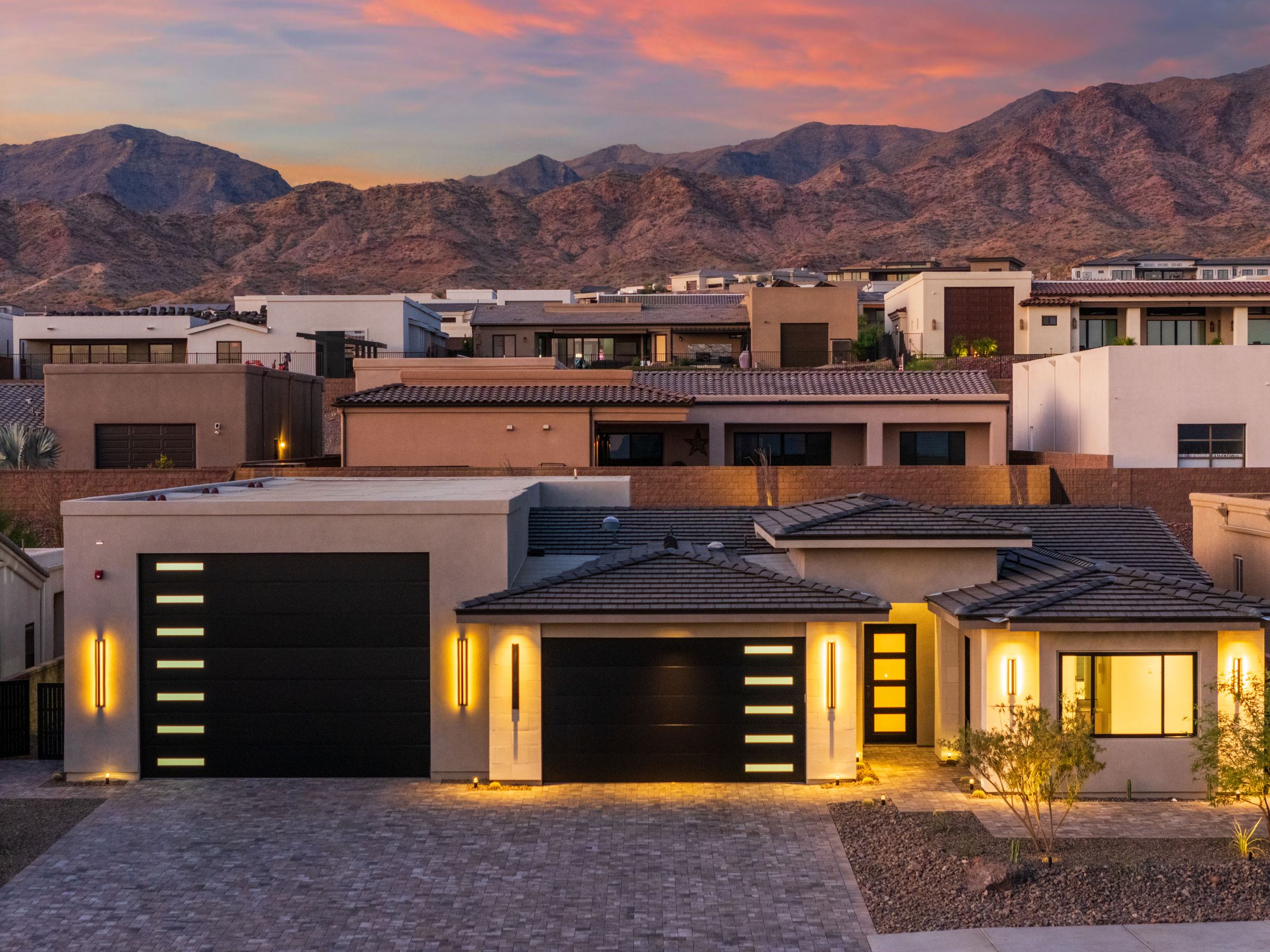 Twilight front exterior of 6873 Avienda De Los Foothills with the 83-foot RV garage